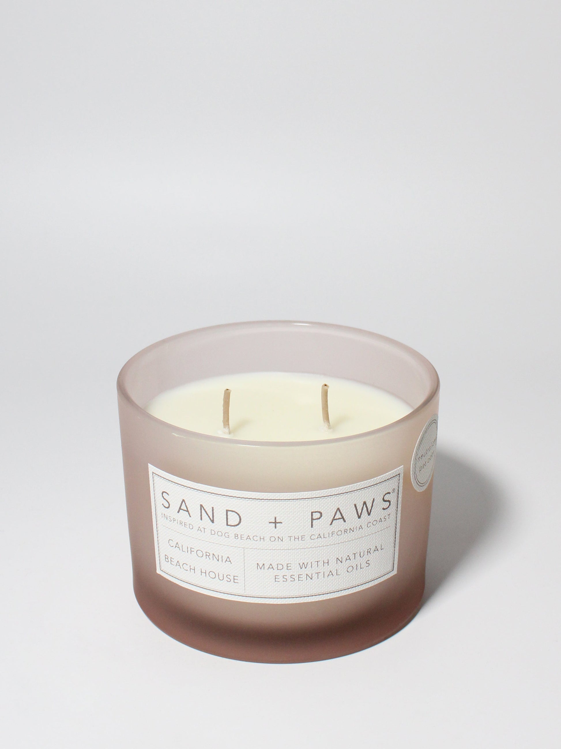 Sand + Paws California Beach House 12 oz scented candle Blush vessel with Painted Paw Grid lid